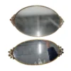 Two oval mirrored serving trays with ornate gold trim.