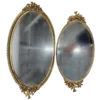Set of oval shaped mirrored trays.