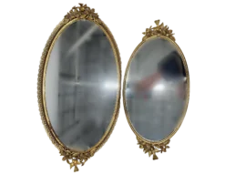 Set of oval shaped mirrored trays.
