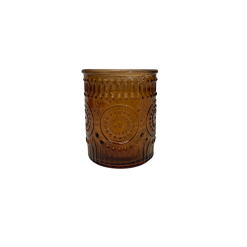 one brown glass votive with a primrose detail in the glass