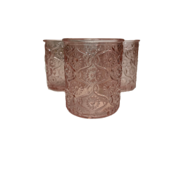 Three blush pink embossed glass votive candle holders.