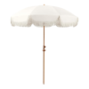 cream colored umbrella with tassles.