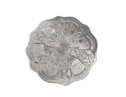 Diamond Jubilee Cake Stand for rent at Violet Vintage Indianapolis: A tall vintage-style pressed glass cake pedestal featuring an intricate starburst and floral pattern, scalloped rims, and a faceted column base for luxury wedding dessert displays.