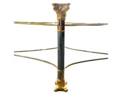 Shagri Coffee Table for rent at Violet Vintage Indianapolis: A Regency-style oval glass coffee table featuring a beveled edge and an ornate mixed-metal base with gold-finished carved capitals, silver pillars, and gold-sculpted feet.