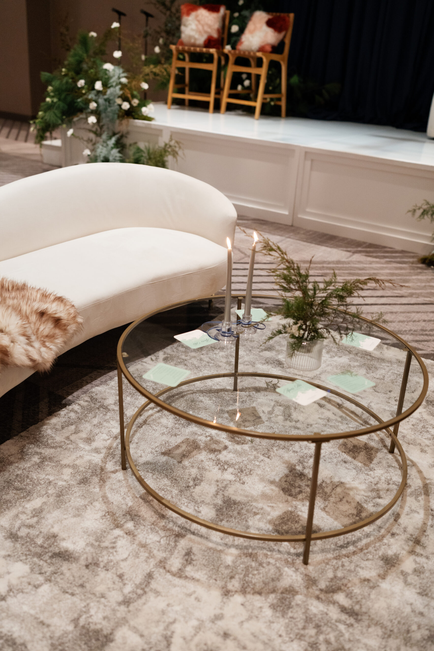 Cream Kanissu Sofa with a round Brugge Coffee Table, neutral rug, and conversation stage behind it at InterContinental Indianapolis