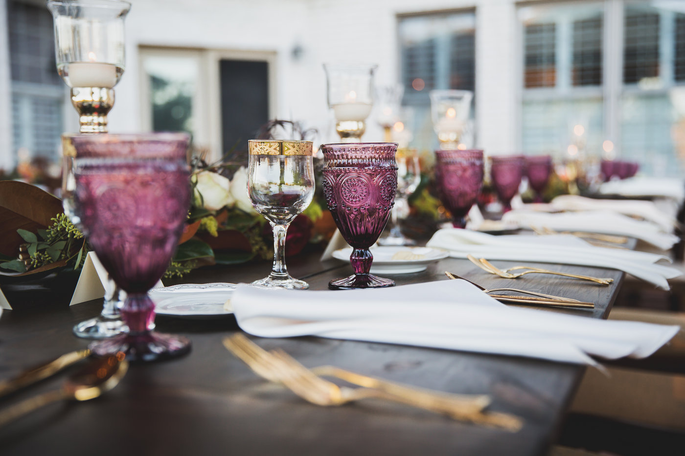 Purple Matching Goblets on a long wedding reception table