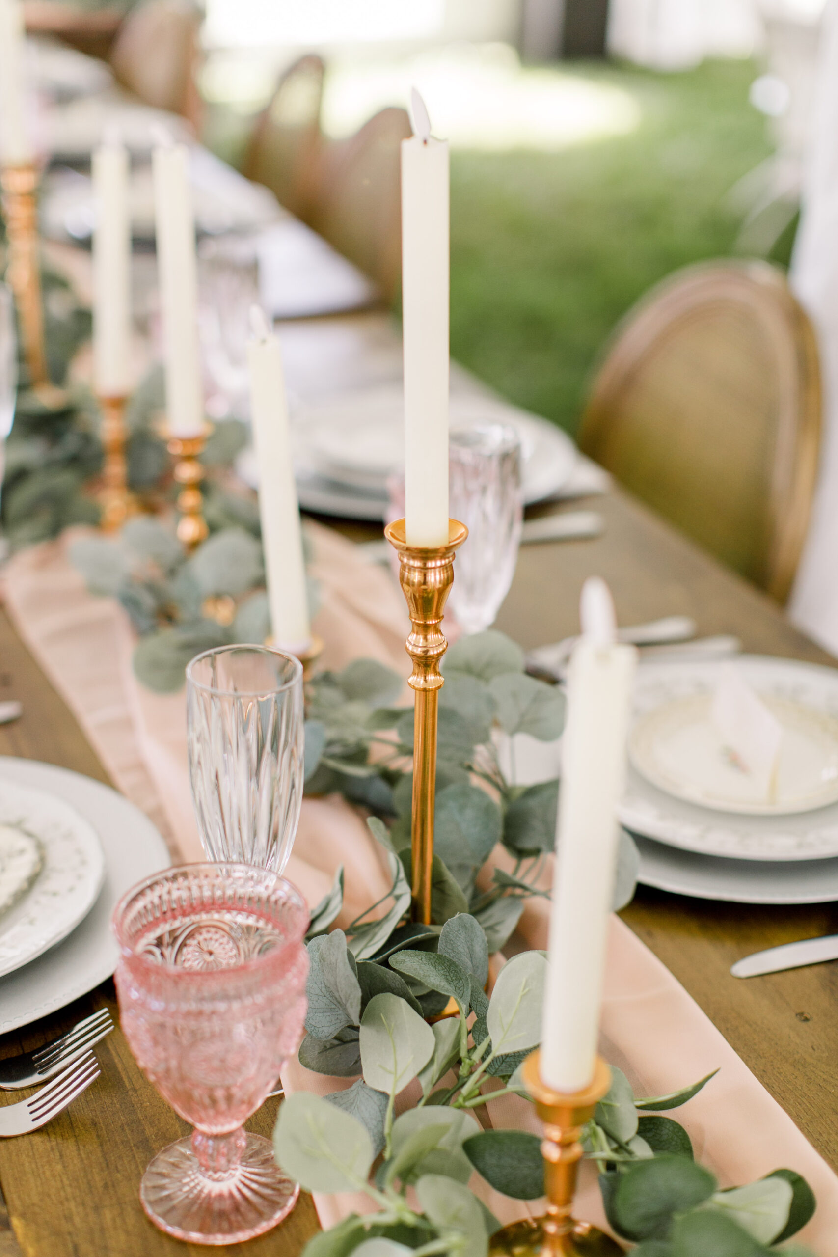Blush Pink Goblets with brass candlesticks and a layered wedding place setting