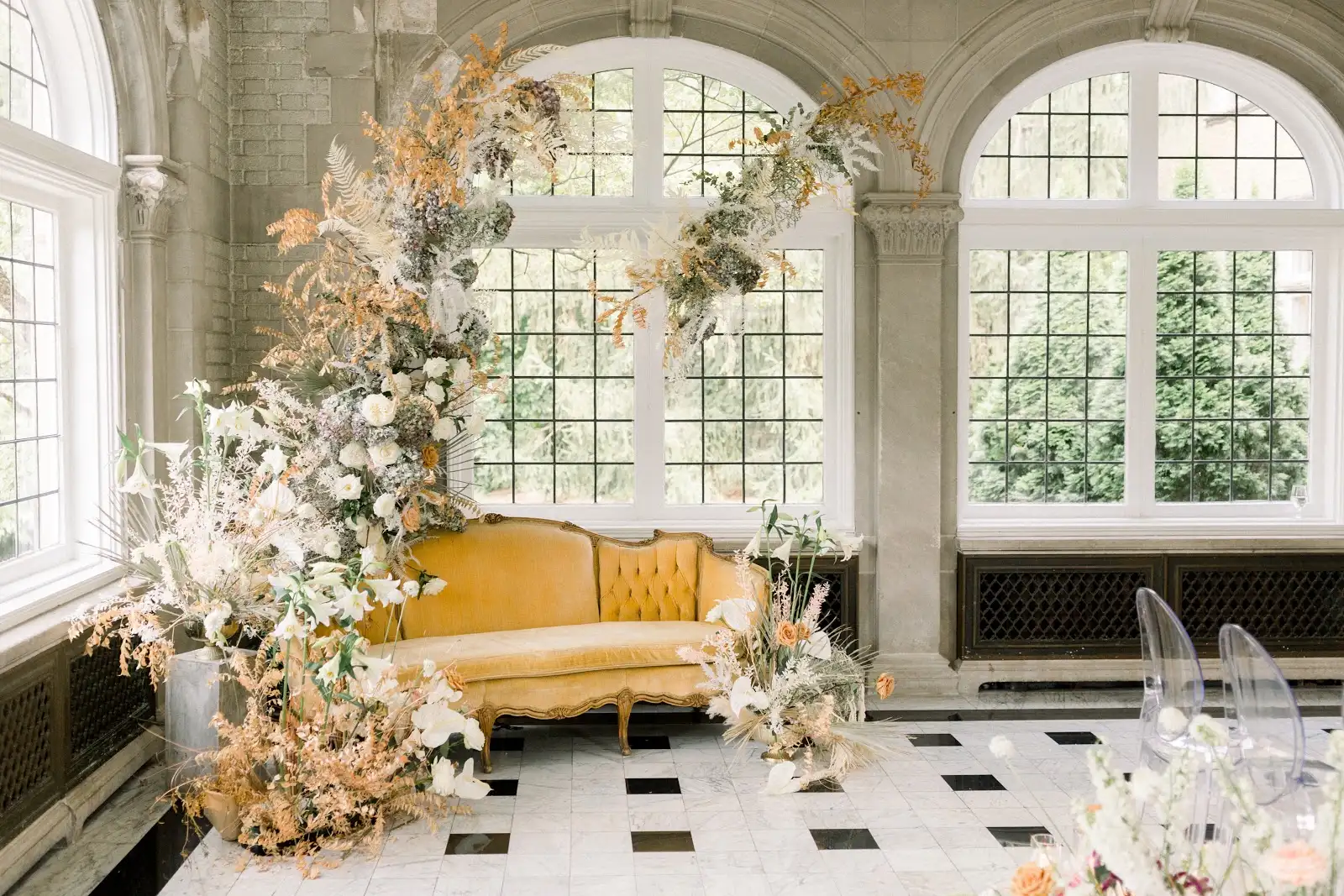 Vermeer Sofa and Ghost Chair styled in an editorial lounge setup by Violet Vintage Rentals