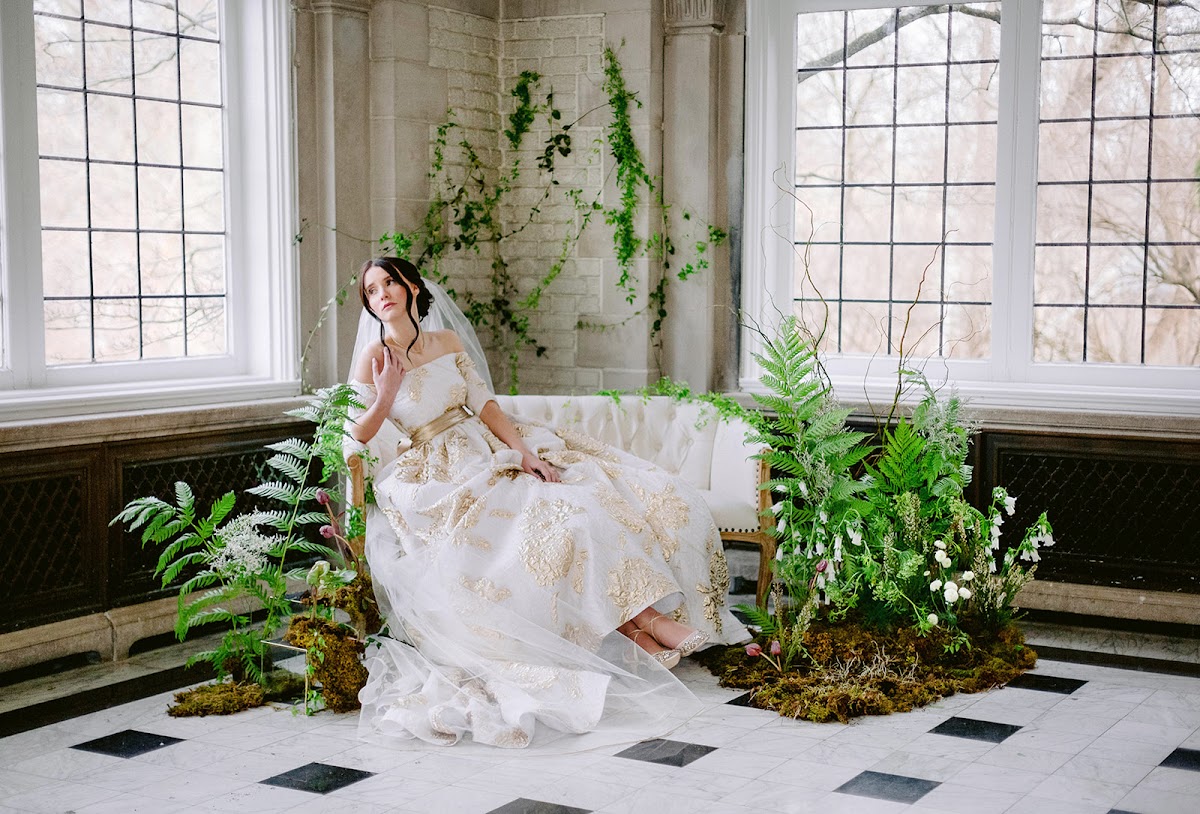 Romantic Laurel Hall wedding inspiration with bride, florals, greenery, and historic windows