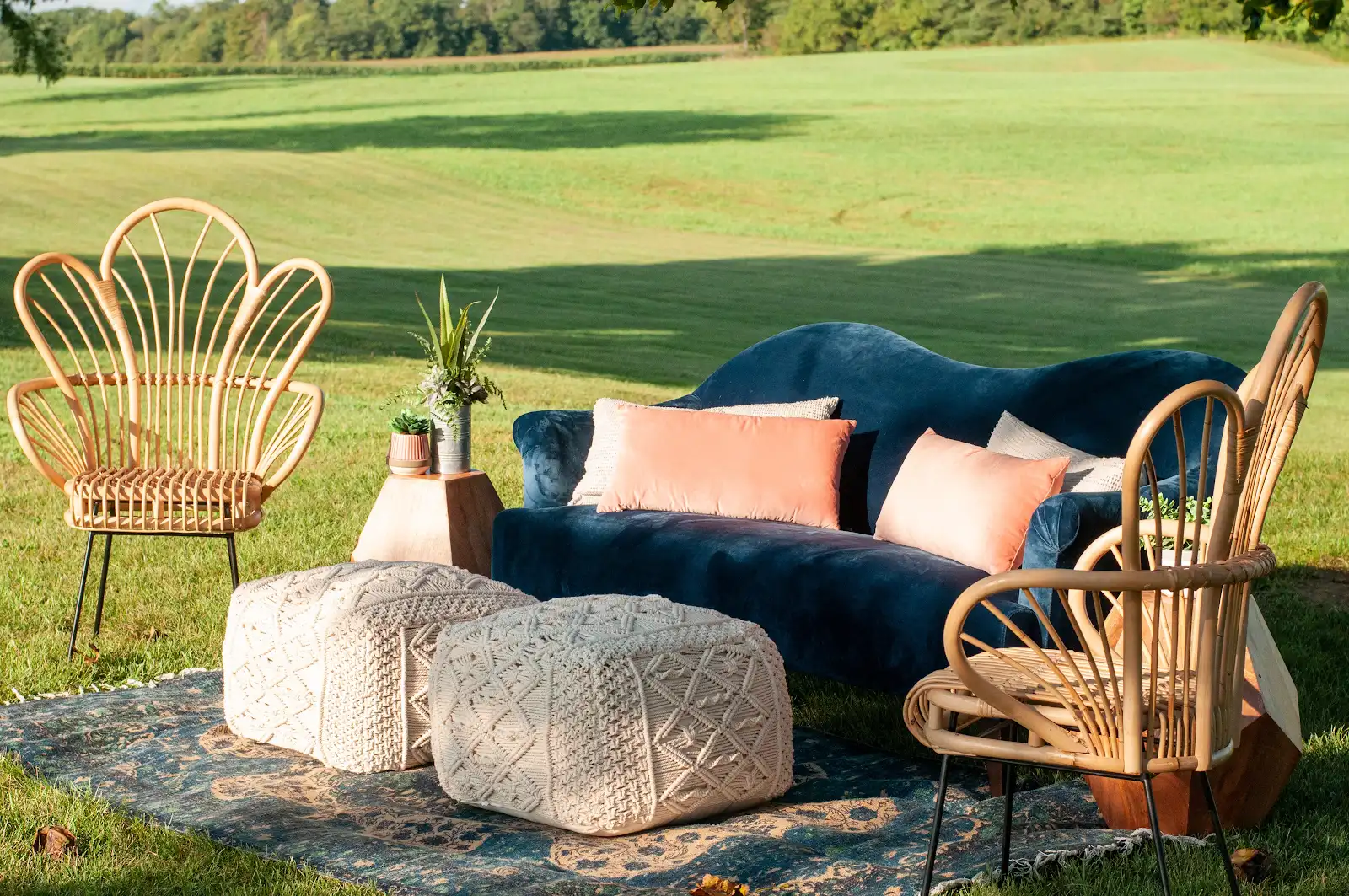 Outdoor lounge rental setup with Esperanza Sofa, Aubree Poufs, Melina Rug, and accent seating by Violet Vintage Rentals