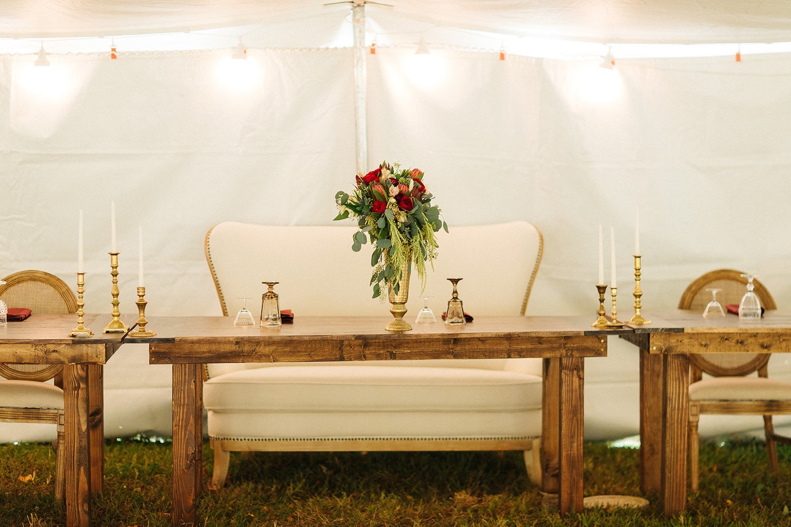 Noema Settee with Kingston Sweetheart Farmtable, Small Brass Candlesticks, and Brown Goblets