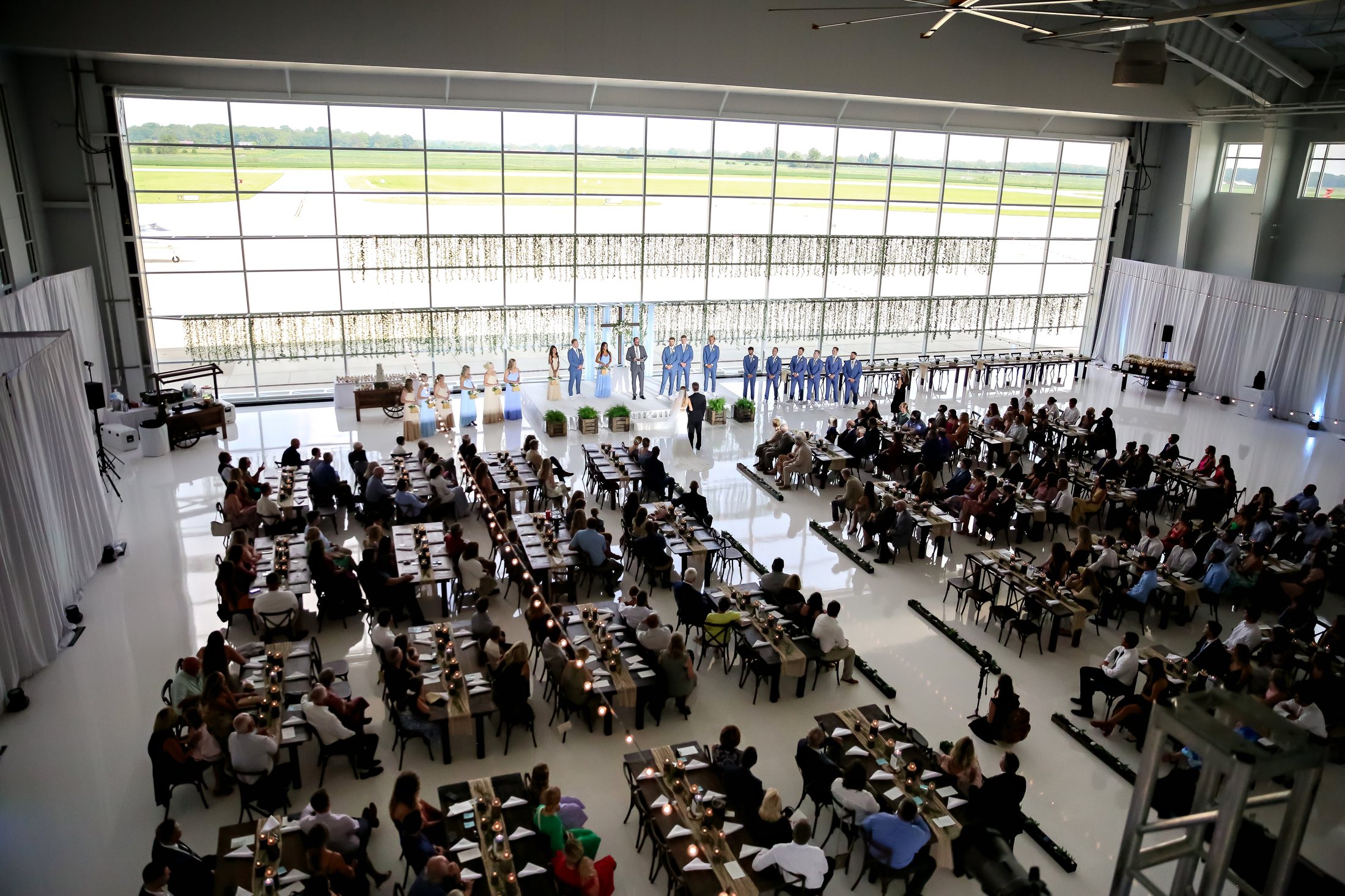 Large wedding reception layout inside Beck's Hangar at Indianapolis Executive Airport in Zionsville.