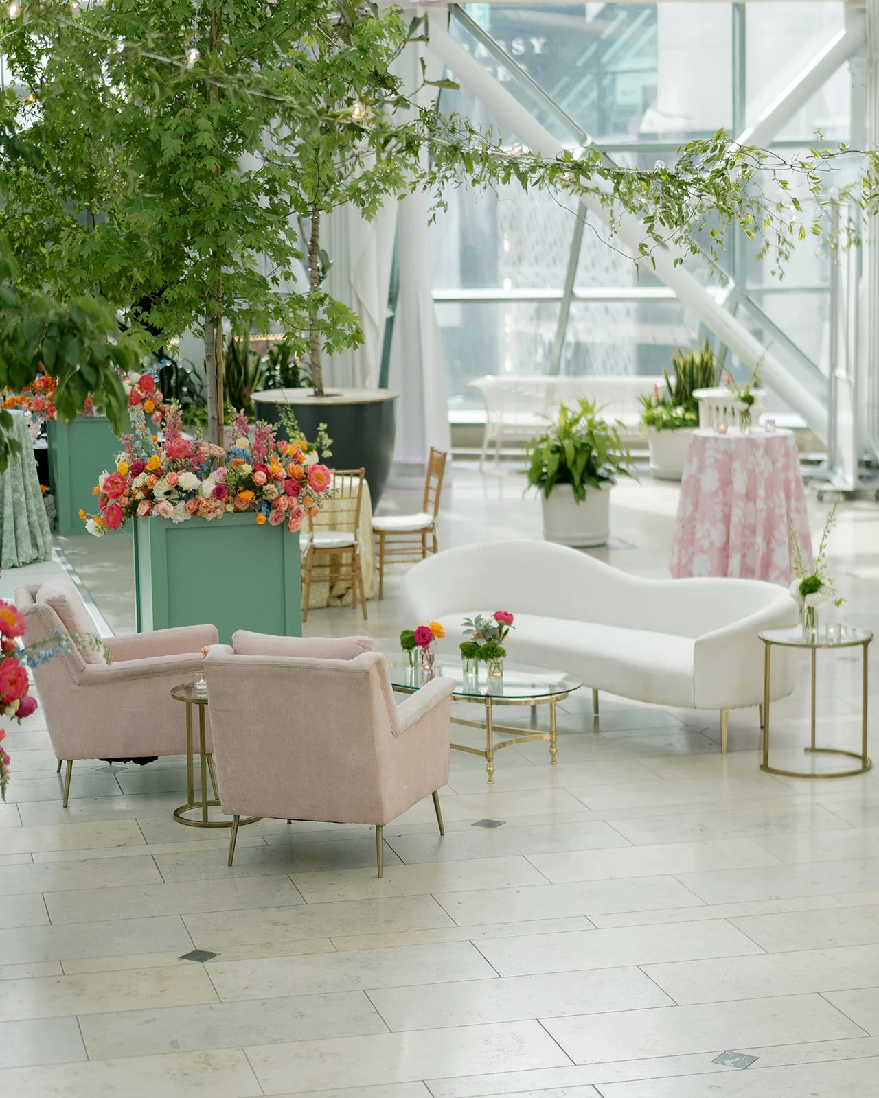 Avalon Sofa and blush Nora Chairs in a pastel Indianapolis Artsgarden wedding lounge